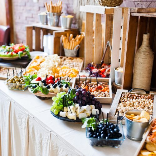 Great variety of different multicolored snacks on the wedding buffet.